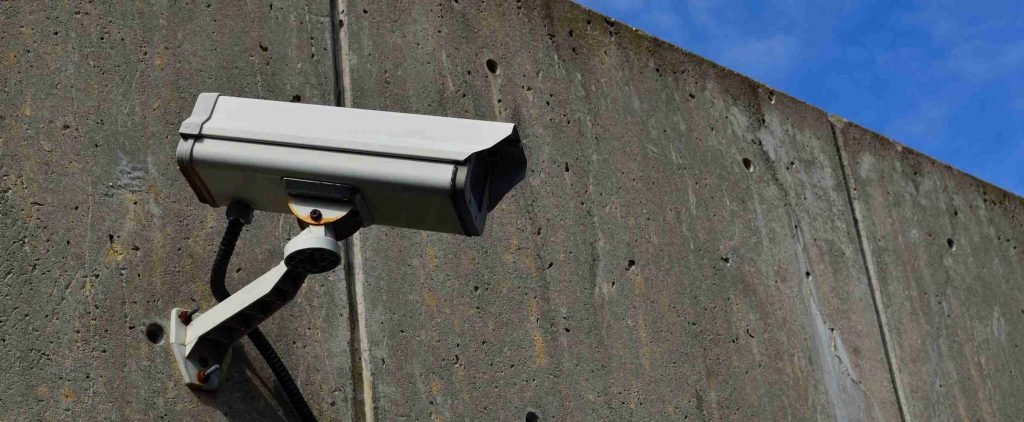 Dorset electrician installing smart security camera with Power over Ethernet cabling